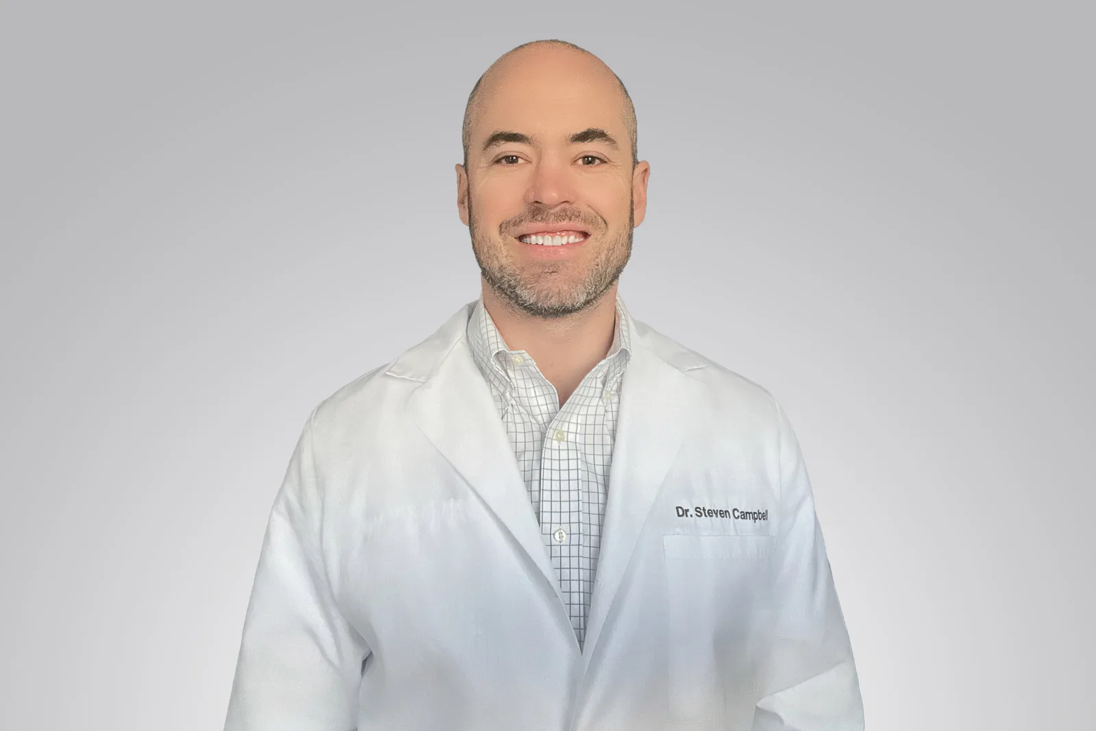 Dr. Steven Campbell in a white coat, smiling