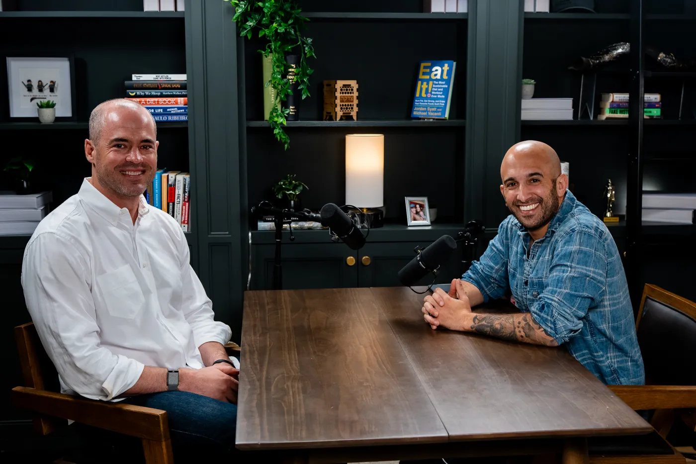 Dr. Steven Campbell and Jordan Syatt seated across a table during a podcast recording